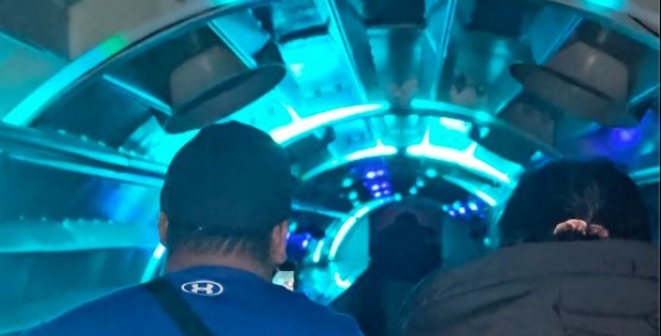 Photo of back of students heads going into the planetarium